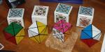 Dino Cube set from 1995 - the 4 versions: original dino design, 2-color, 4-color and 6-color